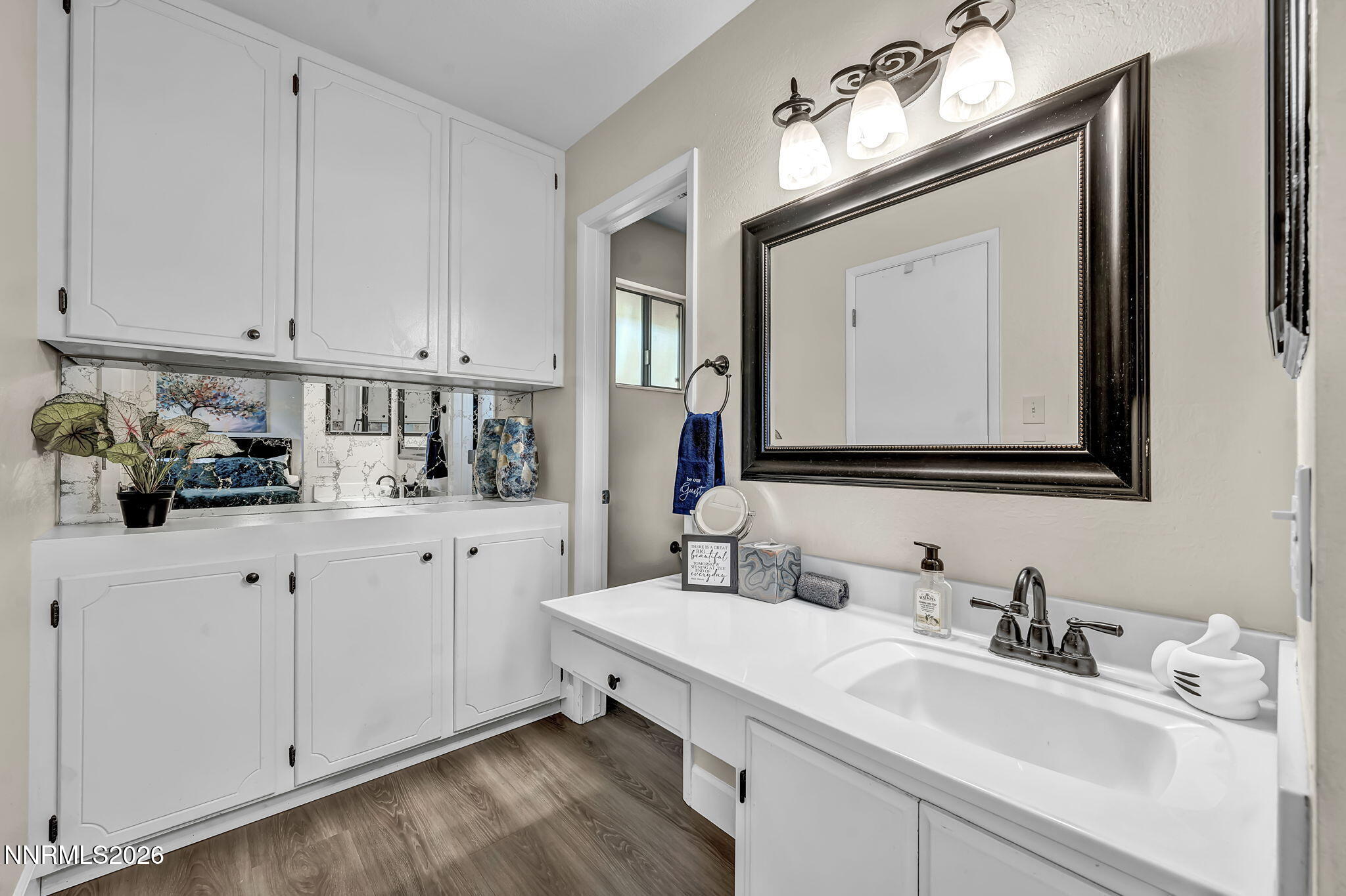 1490 Foster Drive Reno, NV 89509 - Photo 30 of 53 a bathroom with a sink vanity and mirror
