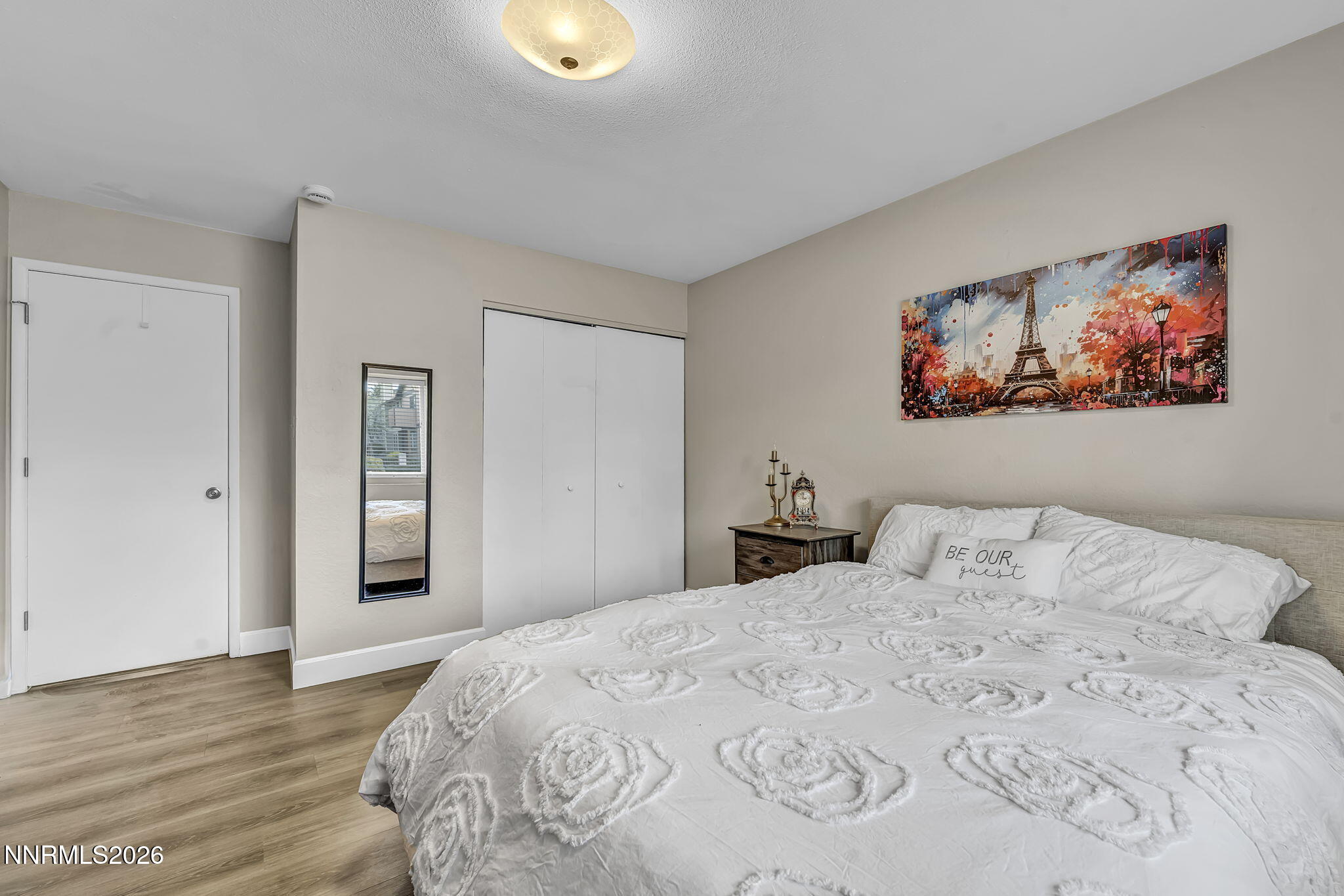 1490 Foster Drive Reno, NV 89509 - Photo 37 of 53 a bedroom with a bed and a painting on the wall