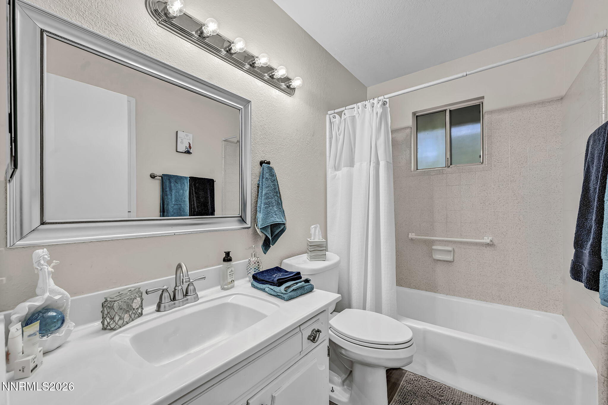 1490 Foster Drive Reno, NV 89509 - Photo 39 of 53 a bathroom with a sink toilet and shower