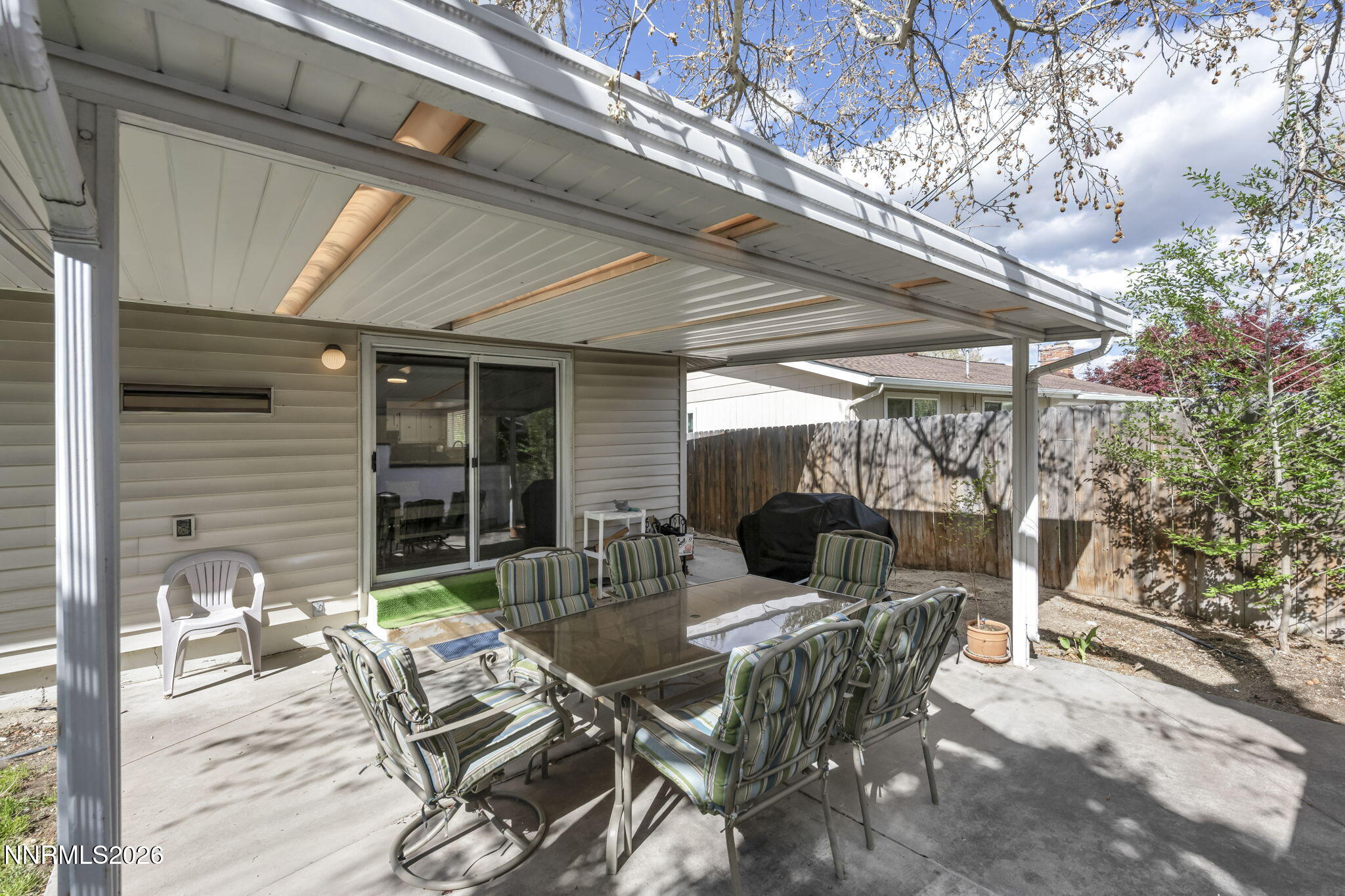 1490 Foster Drive Reno, NV 89509 - Photo 43 of 53 a view of a patio with table and chairs and potted plants