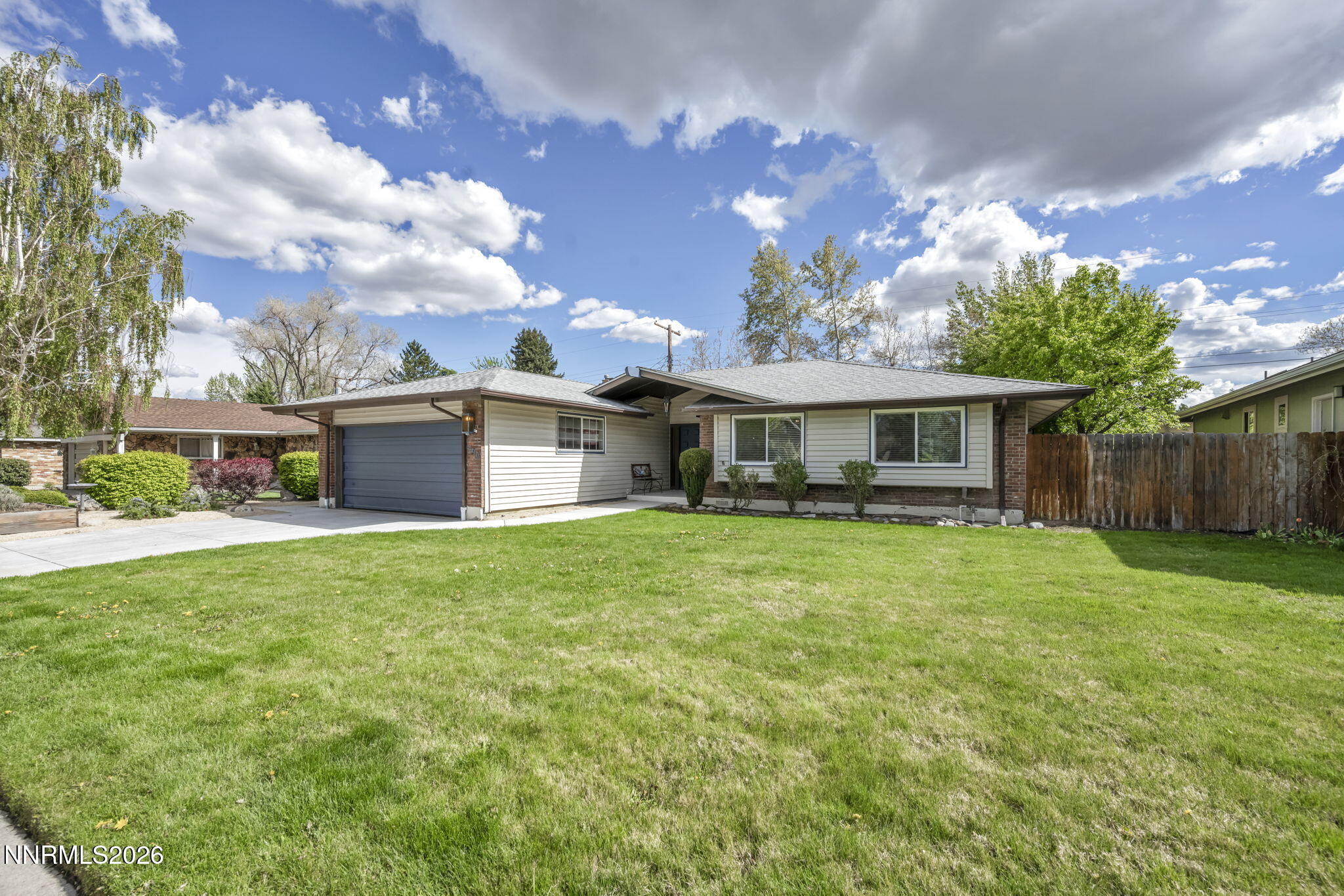 1490 Foster Drive Reno, NV 89509 - Photo 51 of 53 a front view of a house with a garden and yard