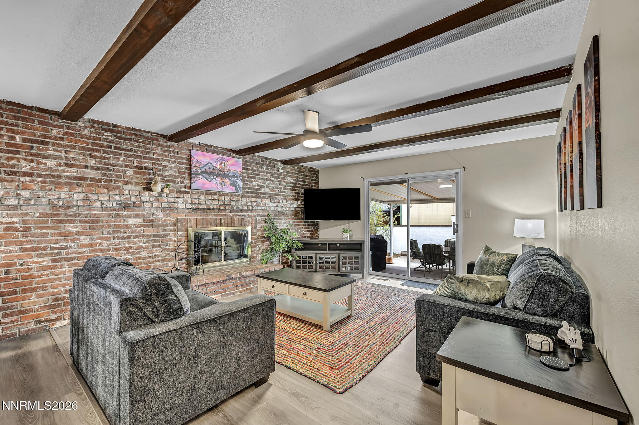 1490 Foster Drive Reno, NV 89509 - Photo 6 of 53 a living room with furniture flat screen tv and a fireplace