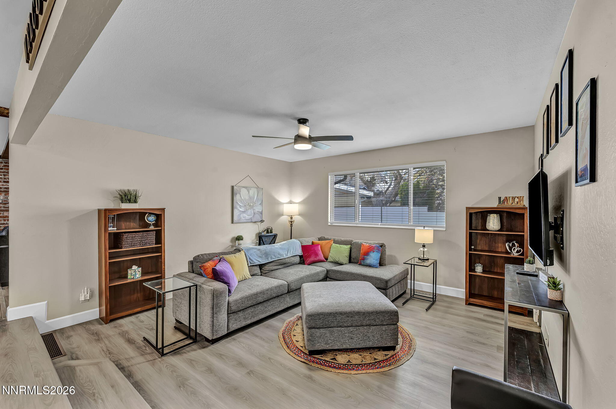1490 Foster Drive Reno, NV 89509 - Photo 9 of 53 a living room with furniture and a flat screen tv