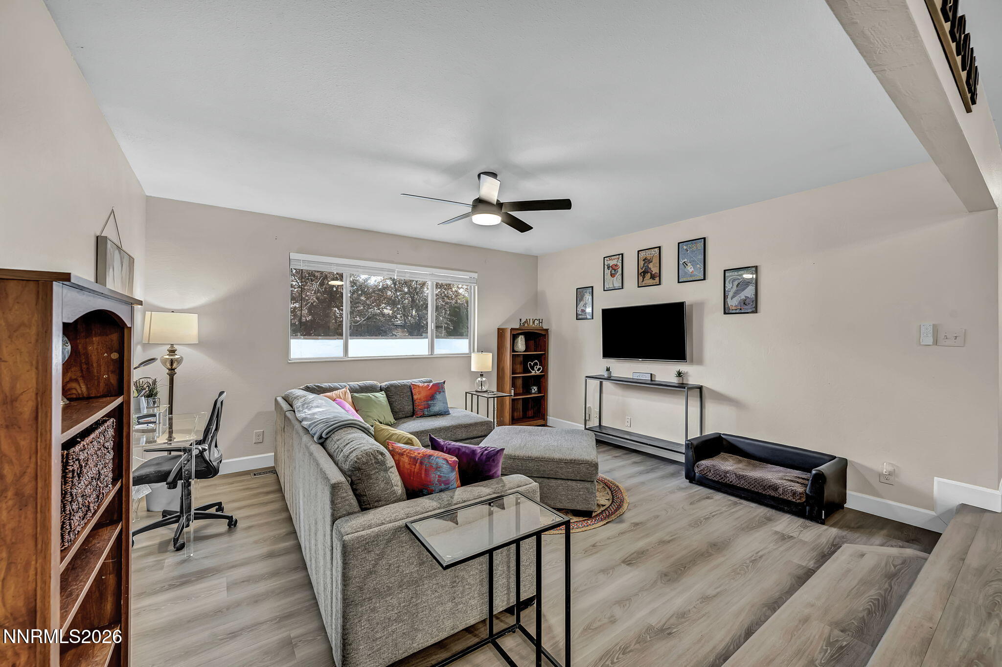 1490 Foster Drive Reno, NV 89509 - Photo 10 of 53 a living room with furniture and a flat screen tv