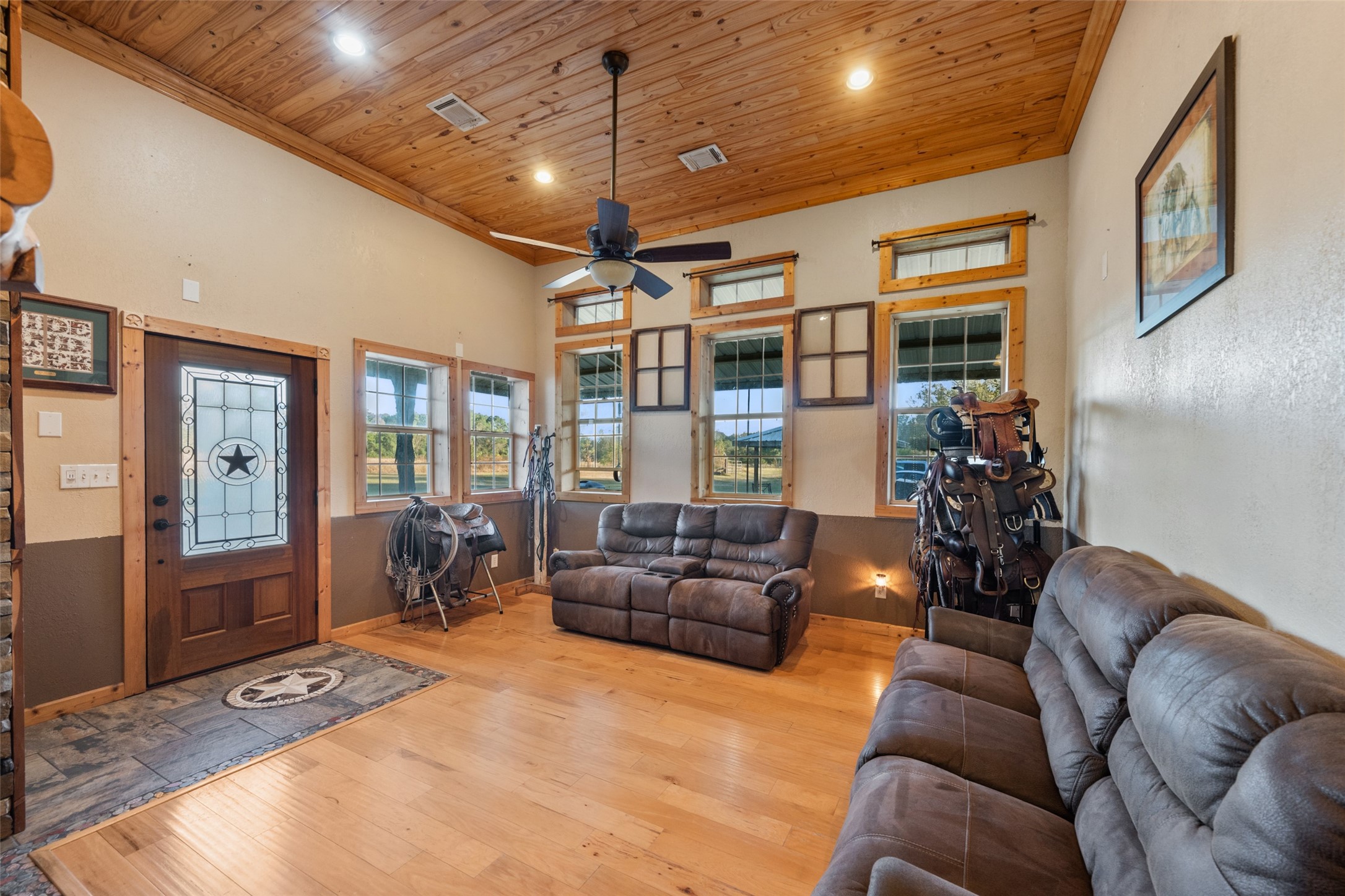 6950 Fm 945 Street North Coldspring, TX 77331 - Photo 17 of 29 a living room with furniture and a chandelier