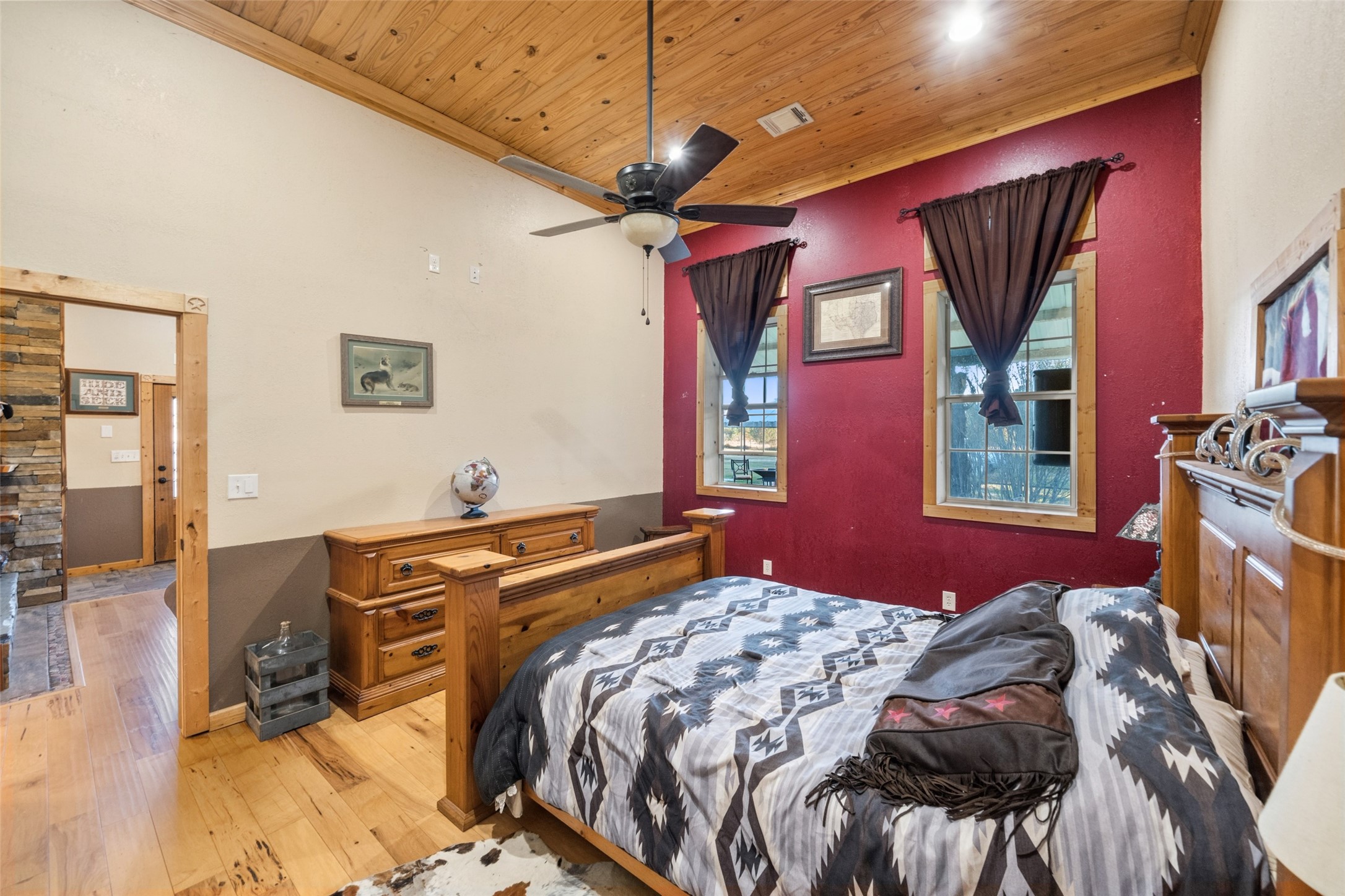 6950 Fm 945 Street North Coldspring, TX 77331 - Photo 20 of 29 a bedroom with a bed dresser and a flat screen tv