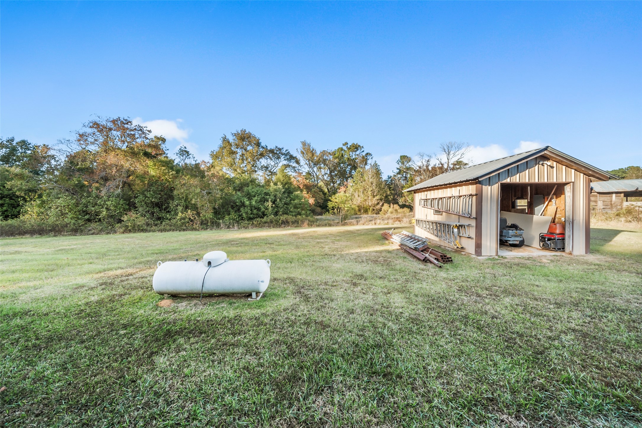 6950 Fm 945 Street North Coldspring, TX 77331 - Photo 26 of 29 a view of a house with a yard