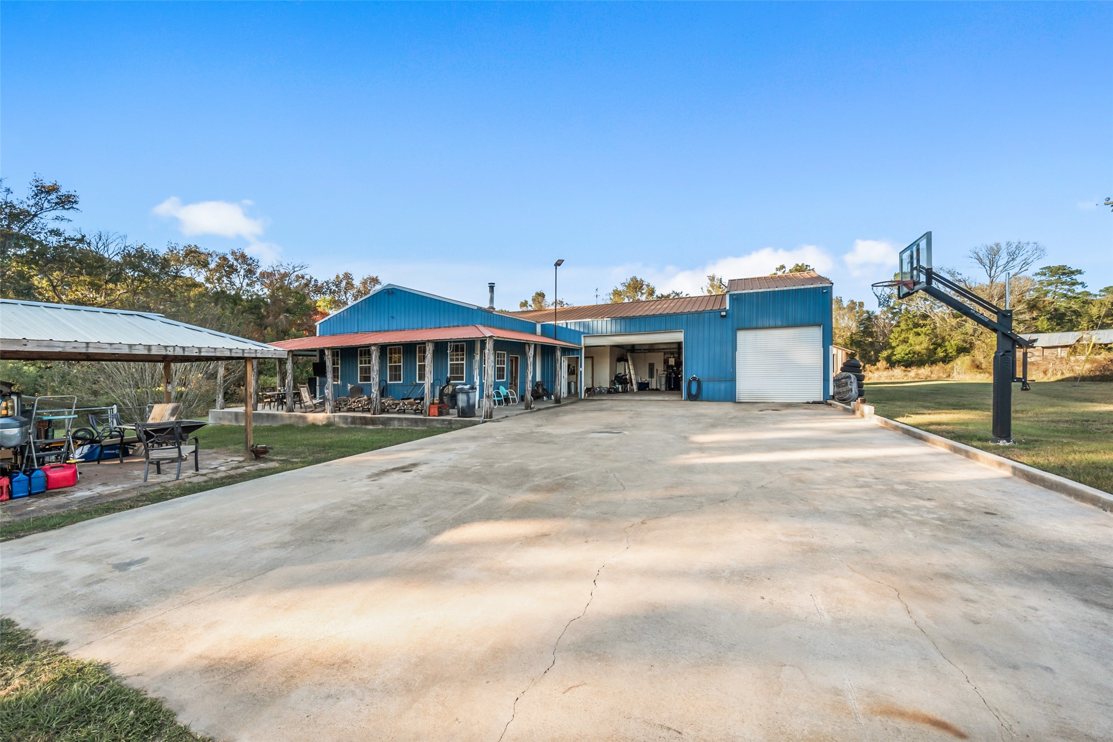 6950 Fm 945 Street North Coldspring, TX 77331 - Photo 7 of 29 a view of a house with a yard