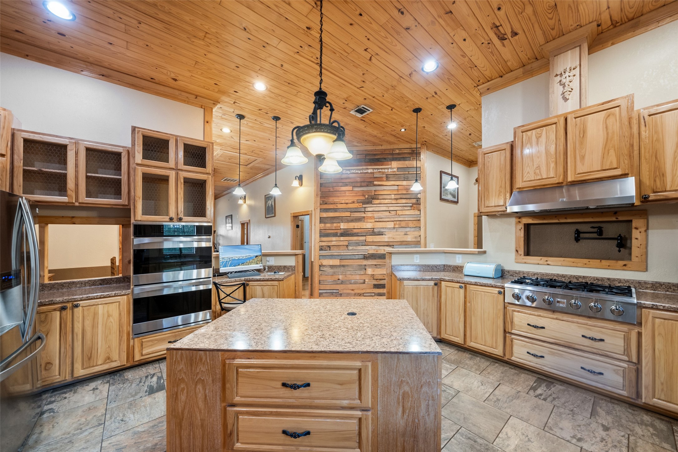 6950 Fm 945 Street North Coldspring, TX 77331 - Photo 10 of 29 a kitchen with stainless steel appliances granite countertop a stove and cabinets