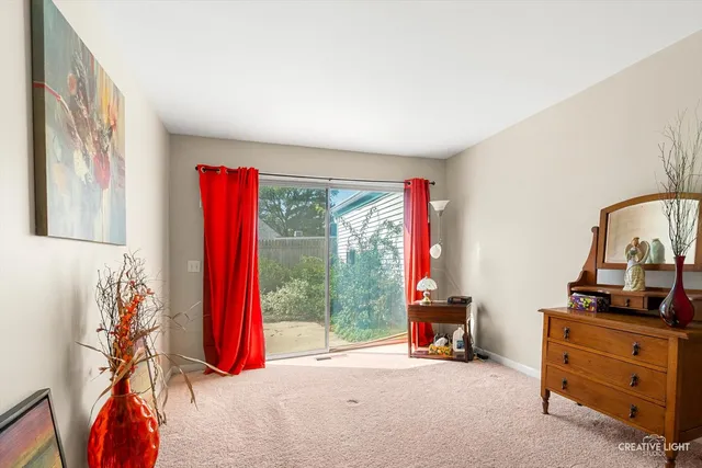 a view of a room with furniture and a large window