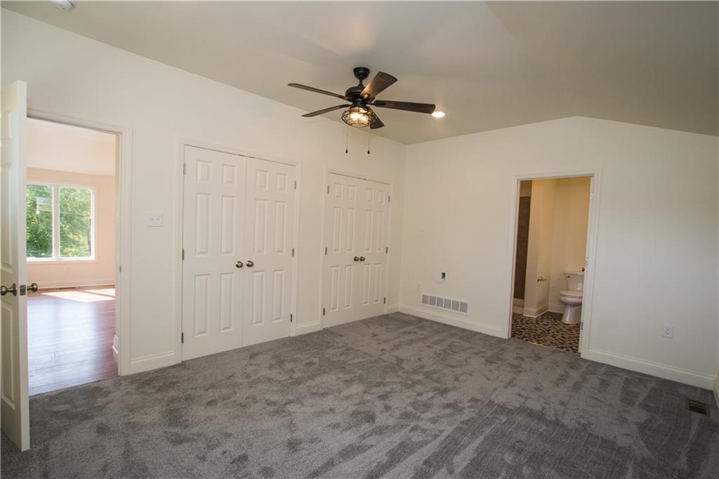 1508 Nine Eighty Road Canonsburg, PA 15317 - Photo 12 of 19 The first floor master suite has two walk-in closets, vaulted ceiling, ceiling fan, recessed lighting and master bath.