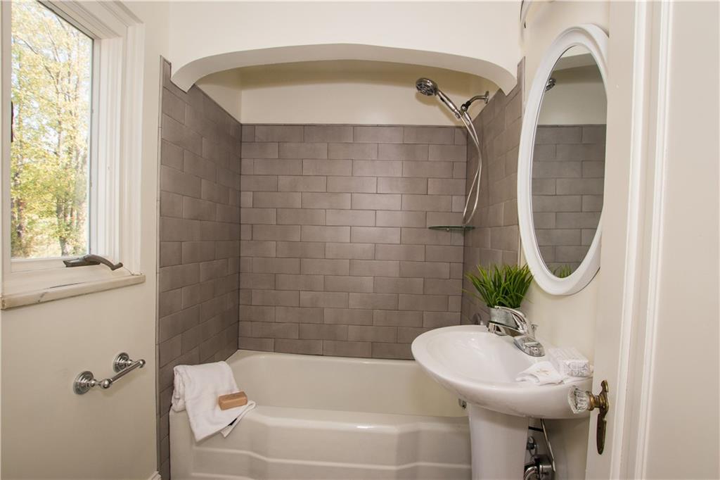 1508 Nine Eighty Road Canonsburg, PA 15317 - Photo 15 of 19 The second floor bathroom offers a tub/shower combo with subway tile design.