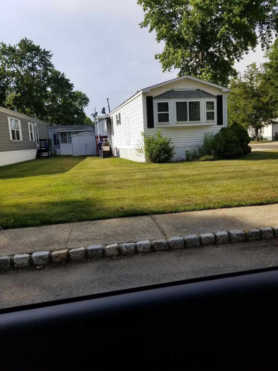 39 Emerson Road North Brunswick, NJ 08902 - Photo 23 of 23 a front view of a house with a garden