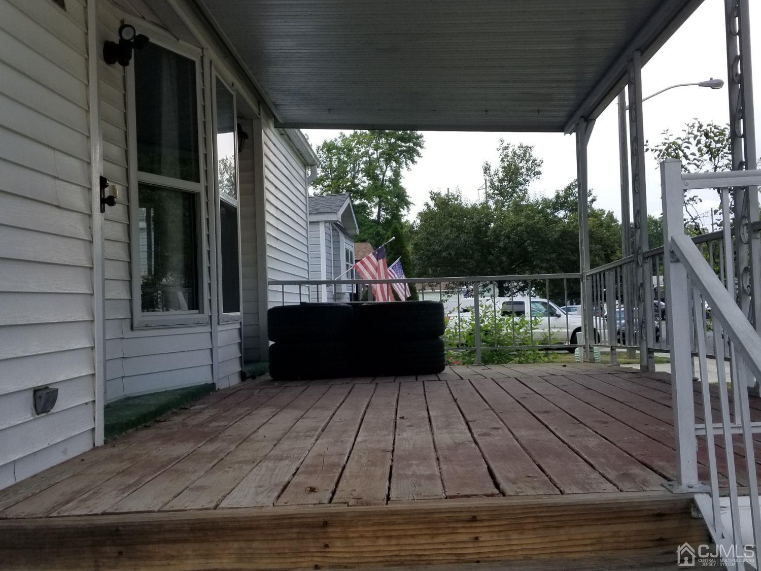 39 Emerson Road North Brunswick, NJ 08902 - Photo 5 of 23 a view of a chairs on the deck