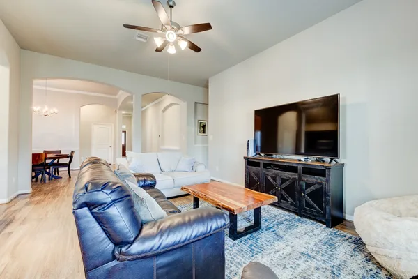 a living room with furniture and a flat screen tv