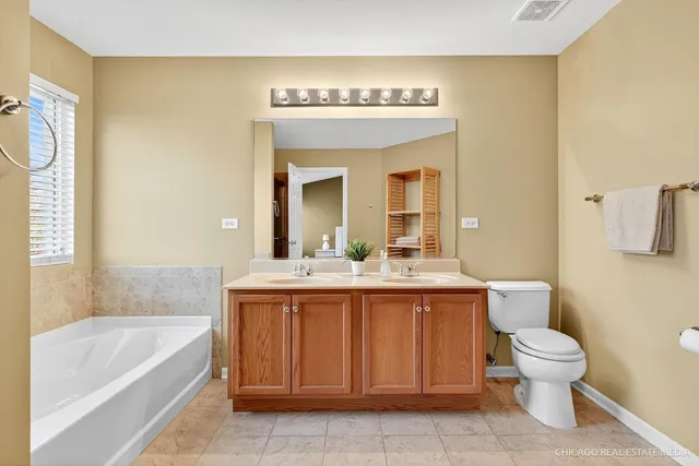 a bathroom with a sink a toilet and bathtub