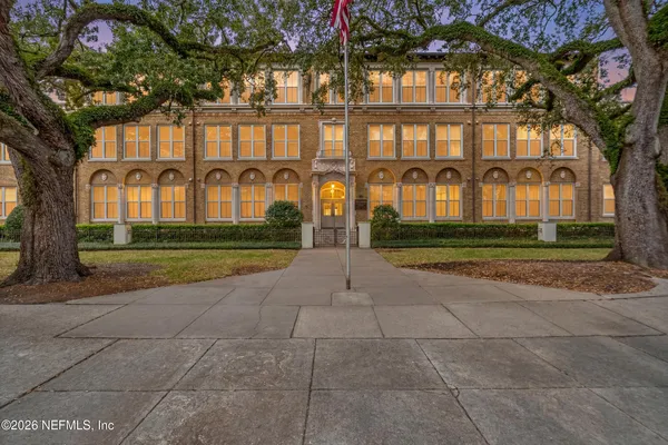 a front view of building with yard