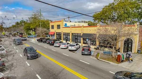 a view of a street with cars