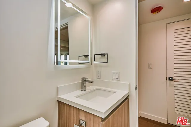 a bathroom with a sink and a mirror