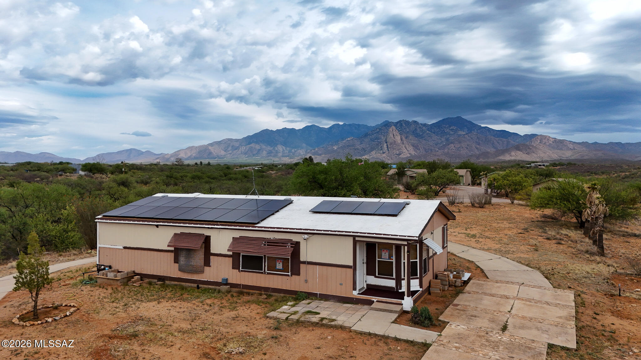 27651 South Canoa Road Amado, AZ 85645 - Photo 19 of 20 a view of a big house with a big yard from a fireplace