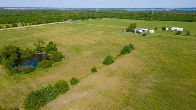 a view of a lake with a yard