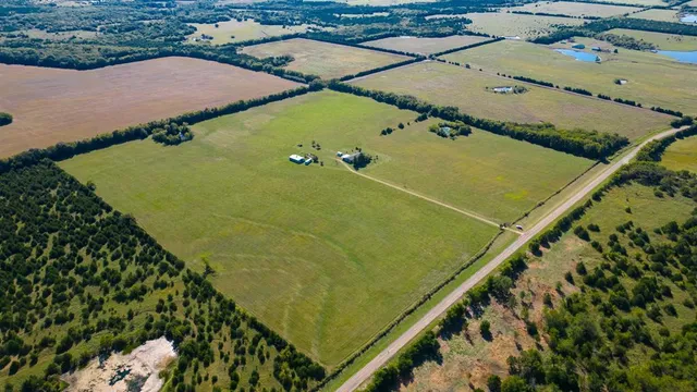 a view of a lake with a yard