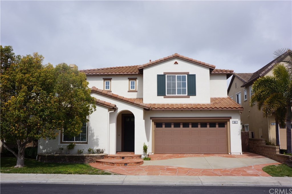 1634 Briar Rose Costa Mesa, CA 92626 - Photo 1 of 1 a front view of a house with a yard
