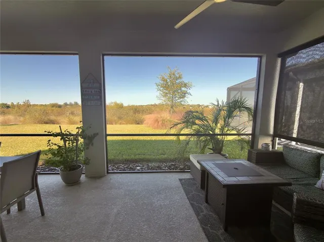 a view of balcony with furniture