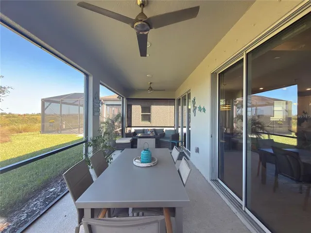 a view of a dining room with furniture window and outside view