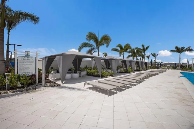 a view of swimming pool with outdoor seating