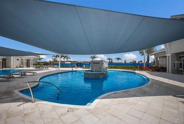 a view of a kitchen with kitchen island and a sink