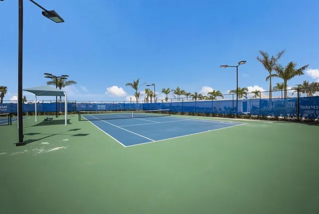a view of a swimming pool with a table and chairs