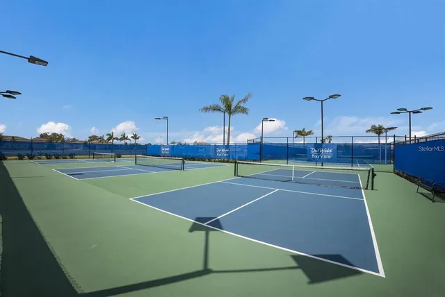 a view of a swimming pool with outdoor seating