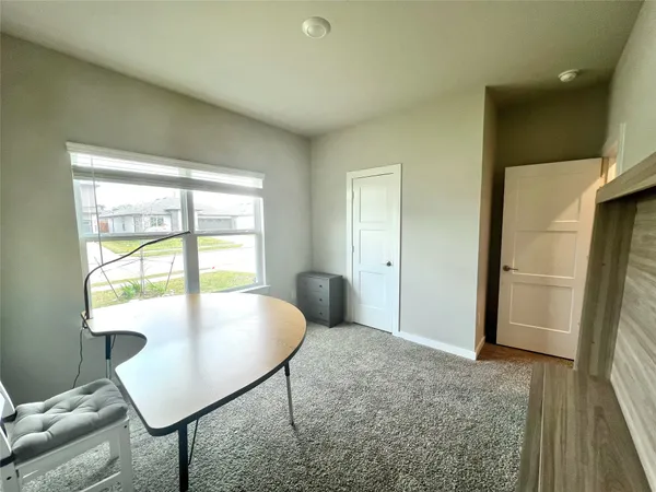 a view of livingroom and dining room with furniture