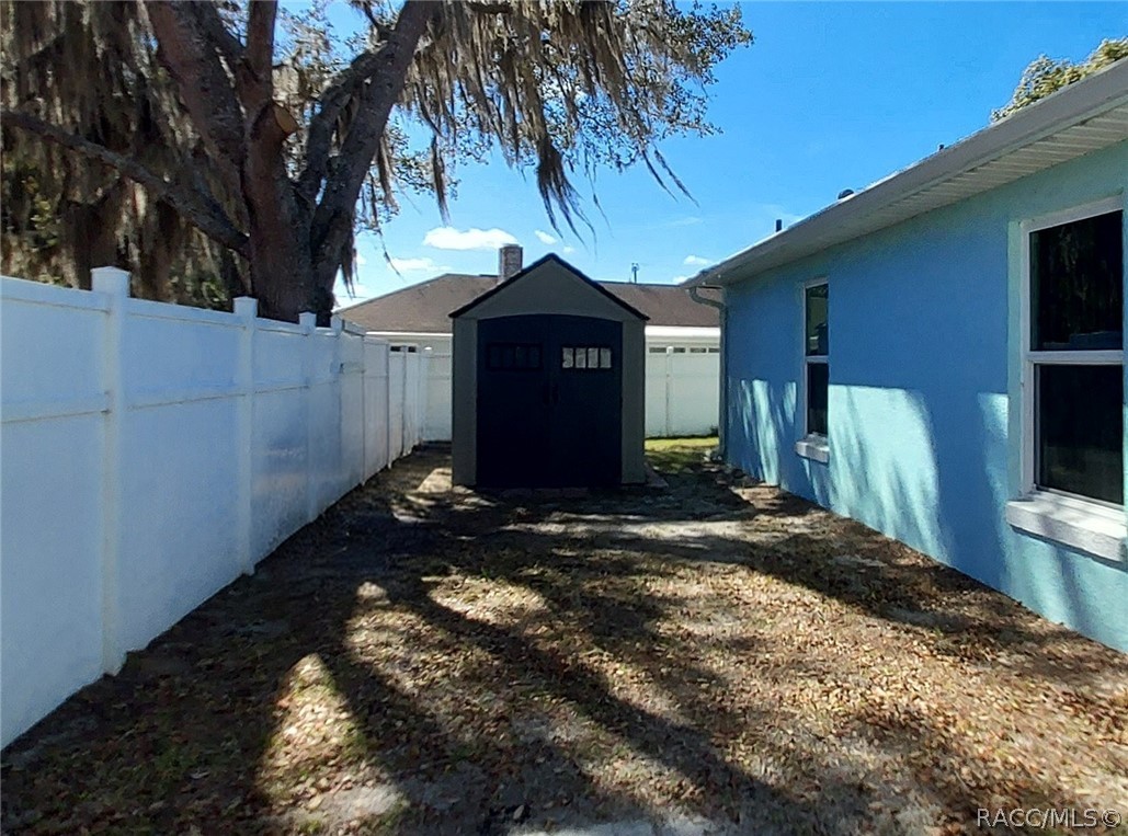 9306 East Gospel Island Road Inverness, FL 34450 - Photo 15 of 16 a front view of a house with a yard