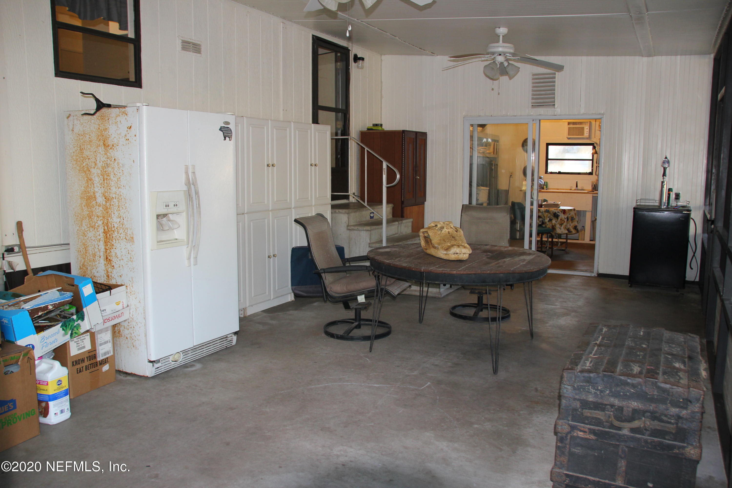 139 Whispering Pines Road Georgetown, FL 32139 - Photo 18 of 42 Screened Porch into cook kitchen
