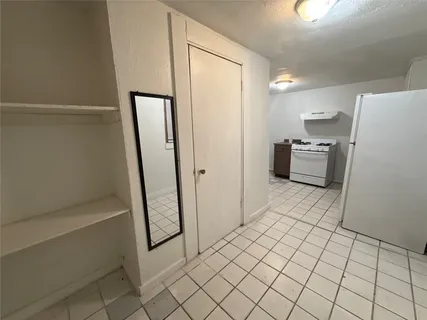 a view of kitchen with furniture and wooden floor