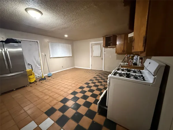 a view of a room with a black and white checkered floor
