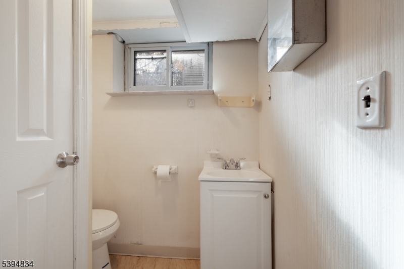 76 Mt Kemble Avenue, Unit 1 Morristown, NJ 07960 - Photo 15 of 20 a bathroom with a toilet sink and vanity