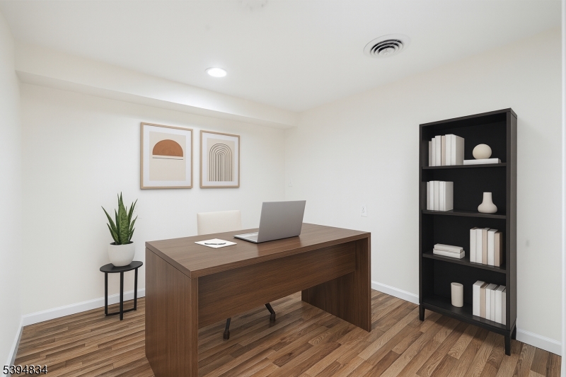 76 Mt Kemble Avenue, Unit 1 Morristown, NJ 07960 - Photo 17 of 20 a view of a workspace with furniture and wooden floor
