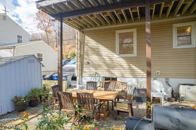 a view of a patio with table and chairs and potted plants