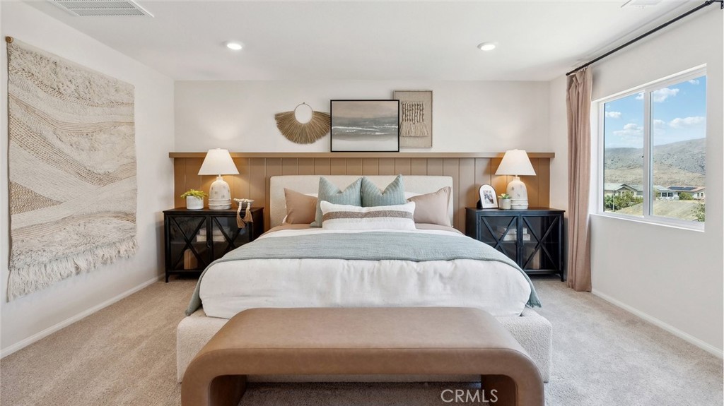11392 Forge Road Corona, CA 92883 - Photo 16 of 24 a bed sitting in a bedroom next to a window