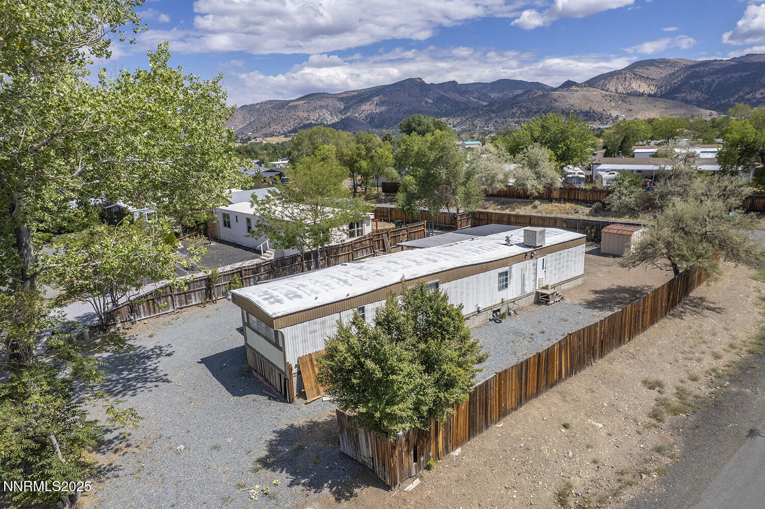 290 Pisces Circle Reno, NV 89521 - Photo 13 of 21 a view of a house with a yard and a large tree