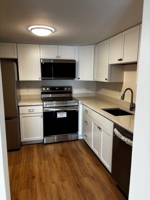12 Chancery Court, Unit 404 Lynn, MA 01902 - Photo 5 of 10 a kitchen with granite countertop a stove top oven and sink