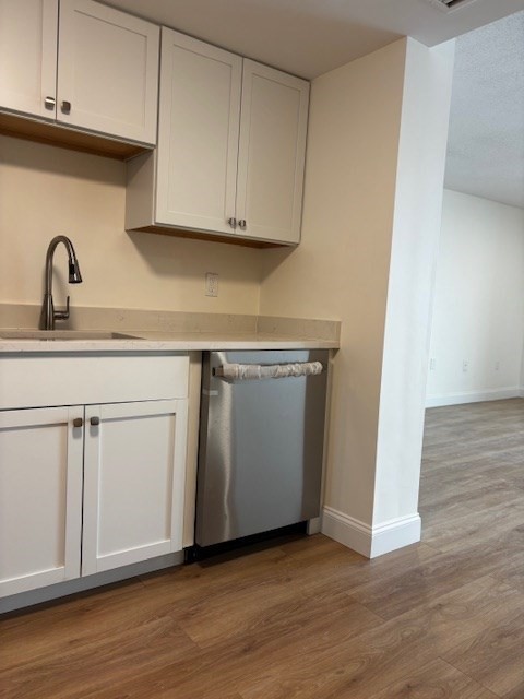 12 Chancery Court, Unit 404 Lynn, MA 01902 - Photo 10 of 10 a view with cabinets and wooden floor
