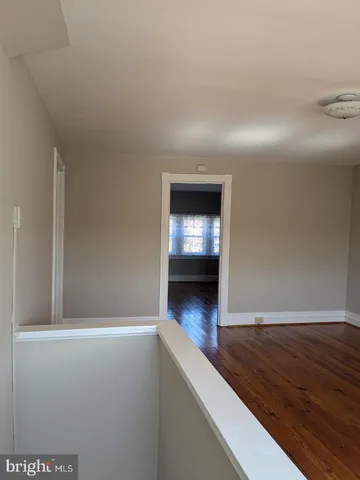 a view of a livingroom with wooden floor