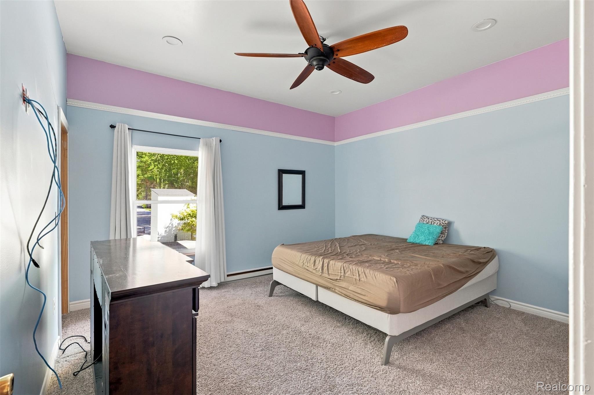 5161 Parker Road Fort Gratiot, MI 48059 - Photo 37 of 64 Carpeted room featuring a ceiling fan with wood-finish blades, recessed lighting, and a window with white drapery