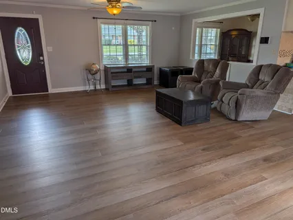 a spacious bedroom with a bed and a couch