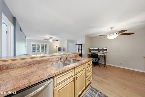 a kitchen with a sink cabinets and appliances