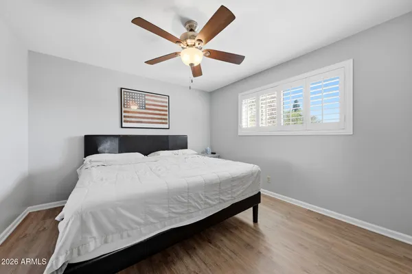 a bedroom with a bed and window